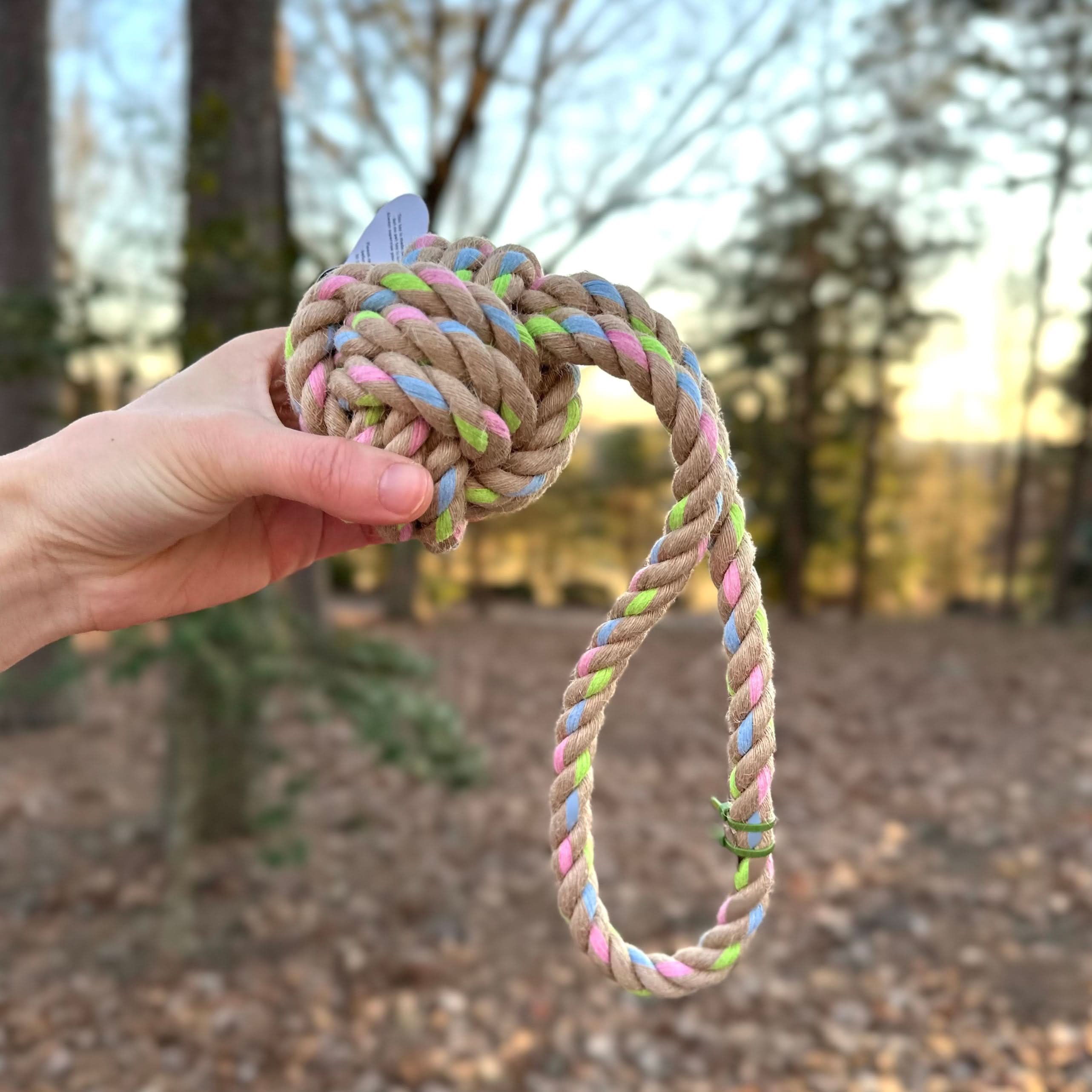 Rainbow Joy Hemp Rope Tug Toy handcrafted with natural hemp and recycled cotton, blue pink green specks, 12.5 inches.